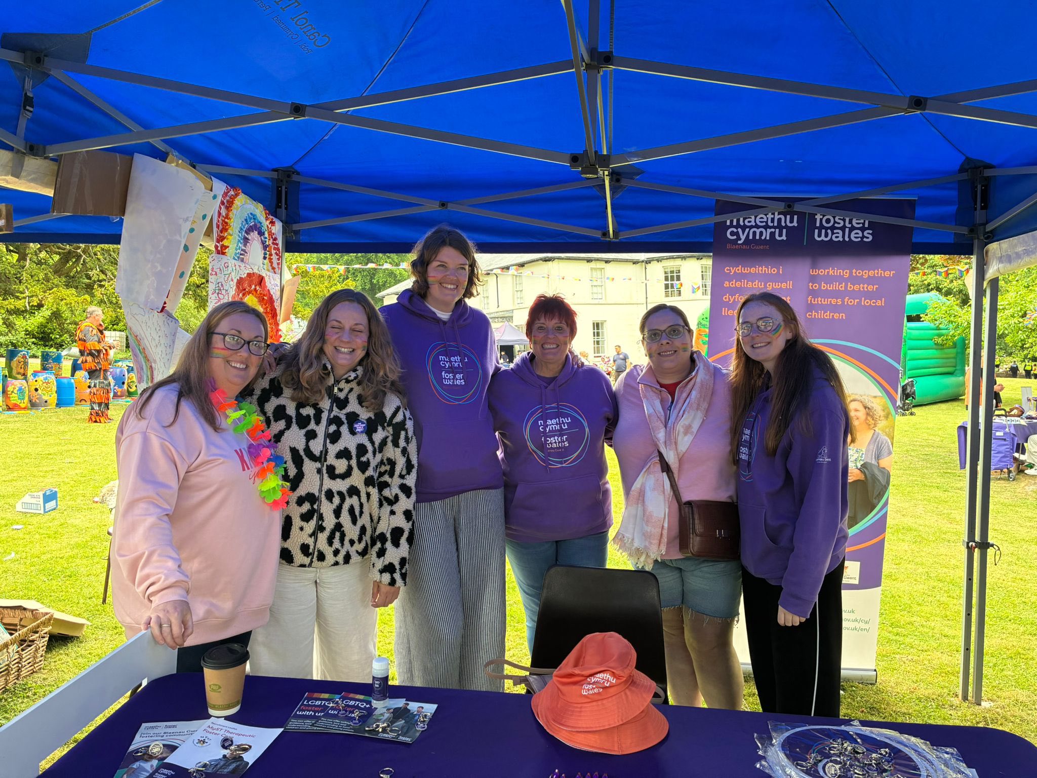 Foster Wales staff at a stand during torfaen pride event